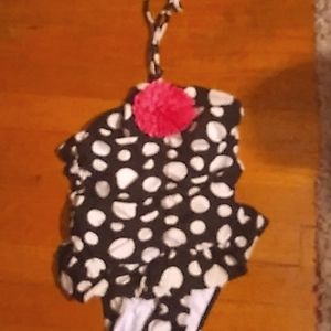 Polkadot child's swimsuit with flower on the top
